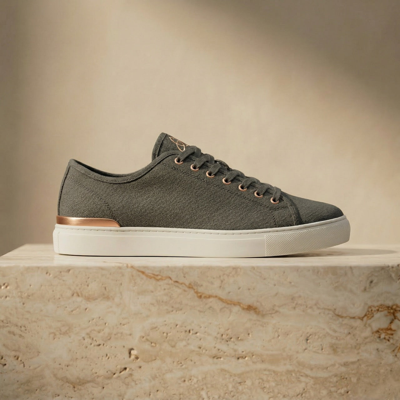 ERTH CLASX basalt canvas sneaker on stone platform with beige background
