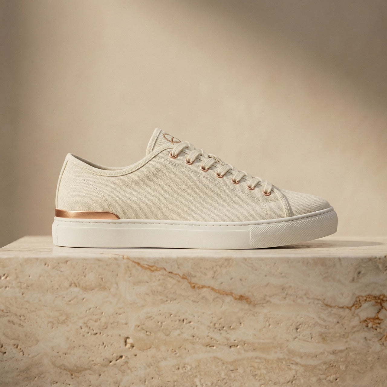 ERTH CLASX sandstone canvas sneaker right facing on a stone platform with a beige background